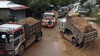 Perfectly new massive landfill project started! A lot of dump trucks waiting to unload soil