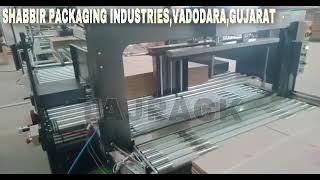 Duble head squaring and strapping machine for corrugated industry