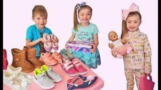 Funny kids play in the shoe store by Dominika Show