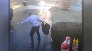 Watch: Man's epic slip down icy driveway