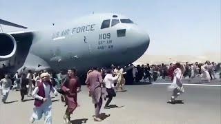 Dramatic video of Afghans clinging to U S  military jet at Kabul airport