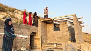 Hardworking and determined grandmother: trying to cover the roof of dreams by the cave