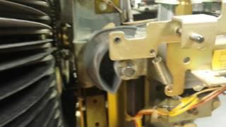 removing a tone arm cam in a rowe record jukebox