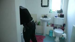 Redditch police searching a property during a drug raid