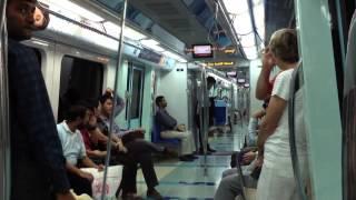 Inside the Dubai Metro train with station announcement