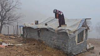 A rainy day, nomadic life, Fatima and her children in the mountains