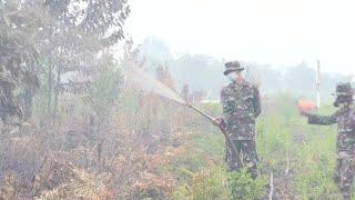 Indonesian firefighters battle underground fires | AFP