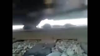 Man gets stuck under moving train