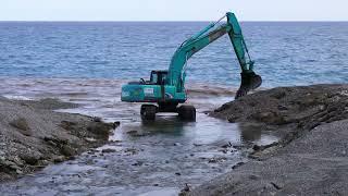 A Backhoe At Work In The Shore