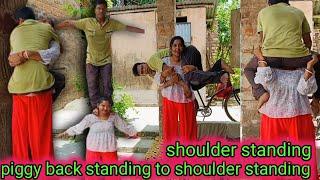 Strong girl shoulder standing boy Piggy back to shoulder standing/shoulder standing/lift carry new.