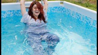 Wetlook - Laura in pool with Converse, jeans and shirt