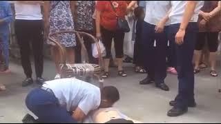 Mouth to mouth resuscitation on woman who fainted in public