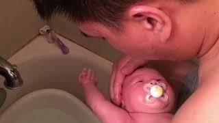 Bubble bath time with her Daddy.