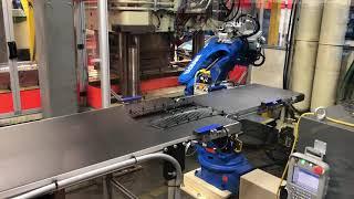 Injection molding press tending with a 6-axis robot with a conveyor end of arm tool