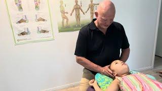 How to massage children. Naturopath Brandon Raynor demonstrates Raynor massage techniques on Ellie 1