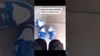 Couples buying matching shoes in a store 