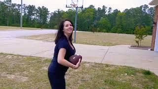 Charlotte throwing the "PassBack" football.