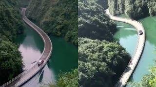 Amazing! Vehicle passes floating bridge with rising waves on river