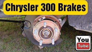 Changing rear brakes on a 2015 chrysler 300 and adjusting emergency brakes.