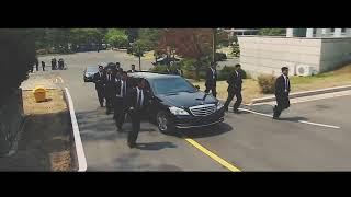 Kim Jong Uns body guards run alongside car carrying official   Daily Mail color graded