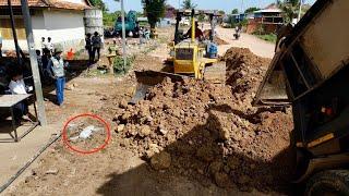 Fantastic Action Filling up soil in flooded road for building base foundation by skillful Dozer