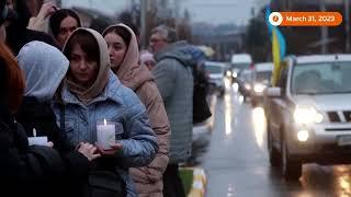 Bucha residents light candles to mark recapture anniversary