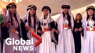 Yazidi women's choir that fled Iraq performs in U.K.