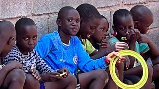 Kids Playing Jacks in Uganda