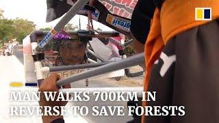 Indonesian man walks 700km in reverse to save forests