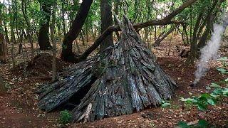 Building bushcraft warm survival shelter | earth fireplace | tree bark roof