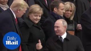 Putin gives Trump the thumbs up as they meet in Paris