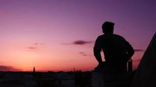 Silhouette of a Man Sitting on the Roof  | Royalty Free Stock Footage Video No Copyright 