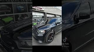 Complete tint, Gloss Black Plasti Dipped Rims, and Red Painted Calipers on this Dodge Durango.