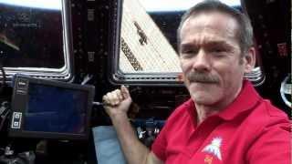 Hadfield behind the controls of Canadarm2