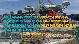 pengerjaan tugu formula one dan pemasangan kursi warna warni di tribun klas ekonomi