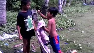 A 9 years old boy fighting a 5 year old boy.