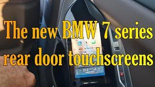 Presentation the new BMW 7 series G70  rear door with integrated touchscreens