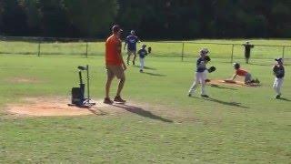 Sean Huggins catches a hit fly ball