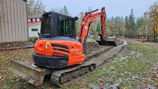 Rock wall footing and ditch cleaning with the Kubota KX 040 4