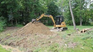 Clearing trees and digging a borrow pit