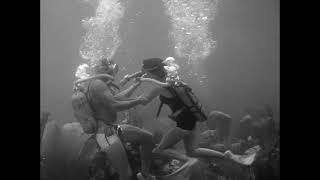 Vintage Scuba Diving Woman Diver rescued by Male Diver 1950s