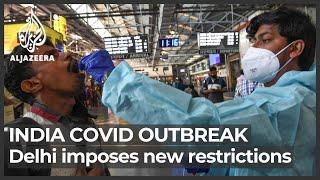 India fears new COVID wave as Omicron infections spread