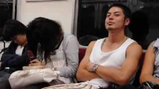 Japanese woman sleeping on a train.