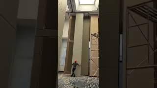 The room divider in the hotel lobby is a movable partition wall