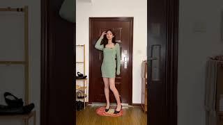 Transgirl in green dress and high heels.