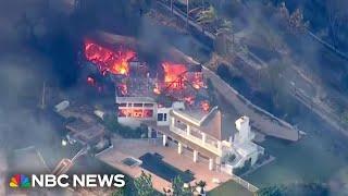 Dozens of homes destroyed by Southern California wildfires