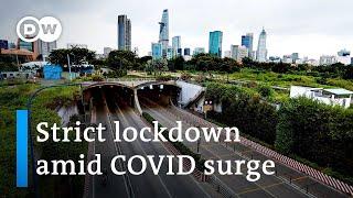 Vietnam on lockdown as COVID cases soar with 0.4% vaccinated | DW News