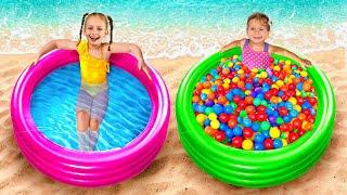 Maya e Mary descansam e brincam com bolas na piscina