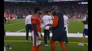 Keenan Allen giving advice to Caleb Williams on the sideline.