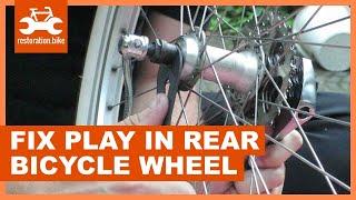 How to fix play in rear bicycle wheel